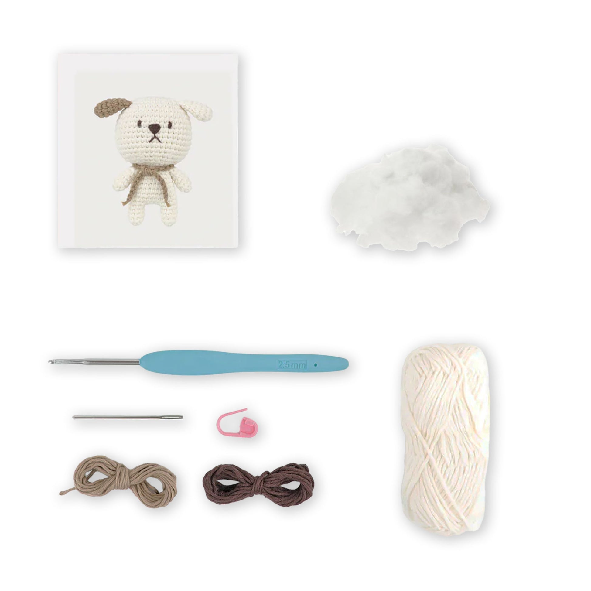 Contenuto kit Daniel the Dog con filato bianco, matassine marroni e accessori