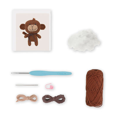 Contenuto kit Mimi the Monkey con filati marroni e accessori