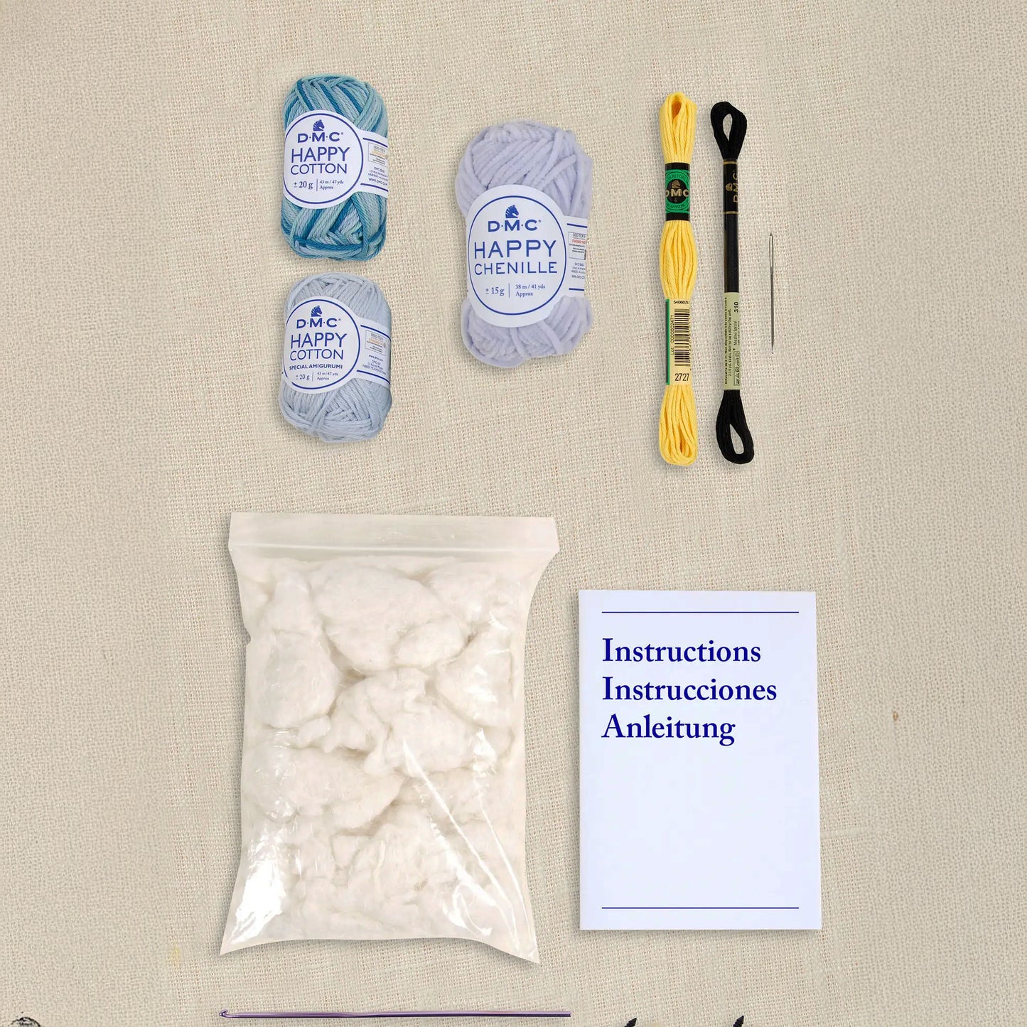 Contenuto kit DMC con filati Happy Cotton, Happy Chenille, imbottitura e accessori
